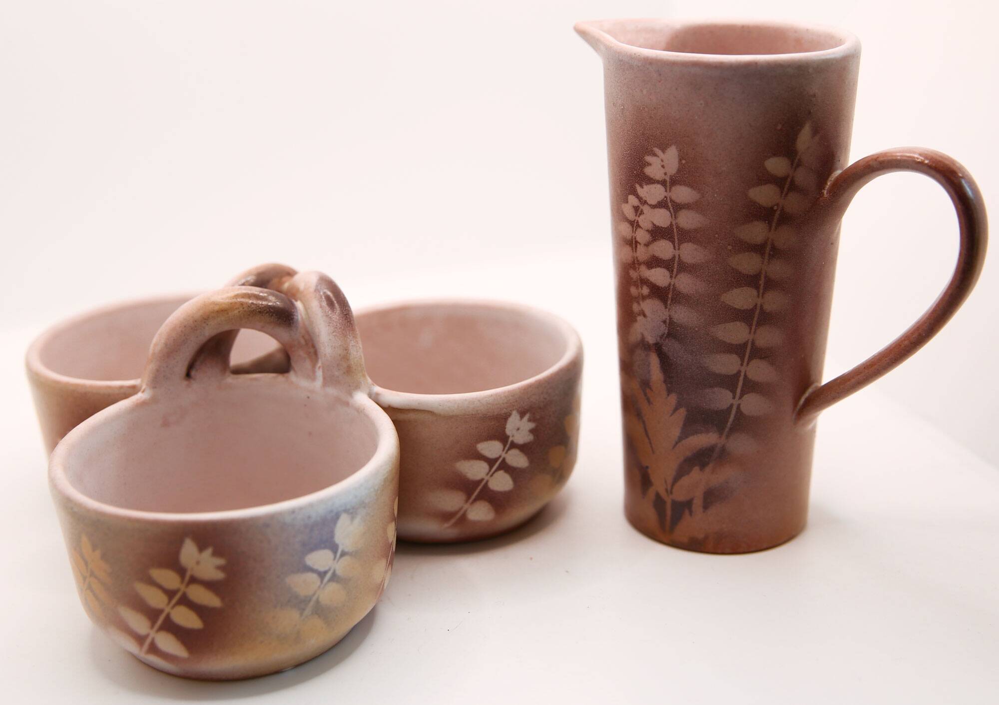 Lot of a pitcher and bowl with old pink flowers by Jean Austruy