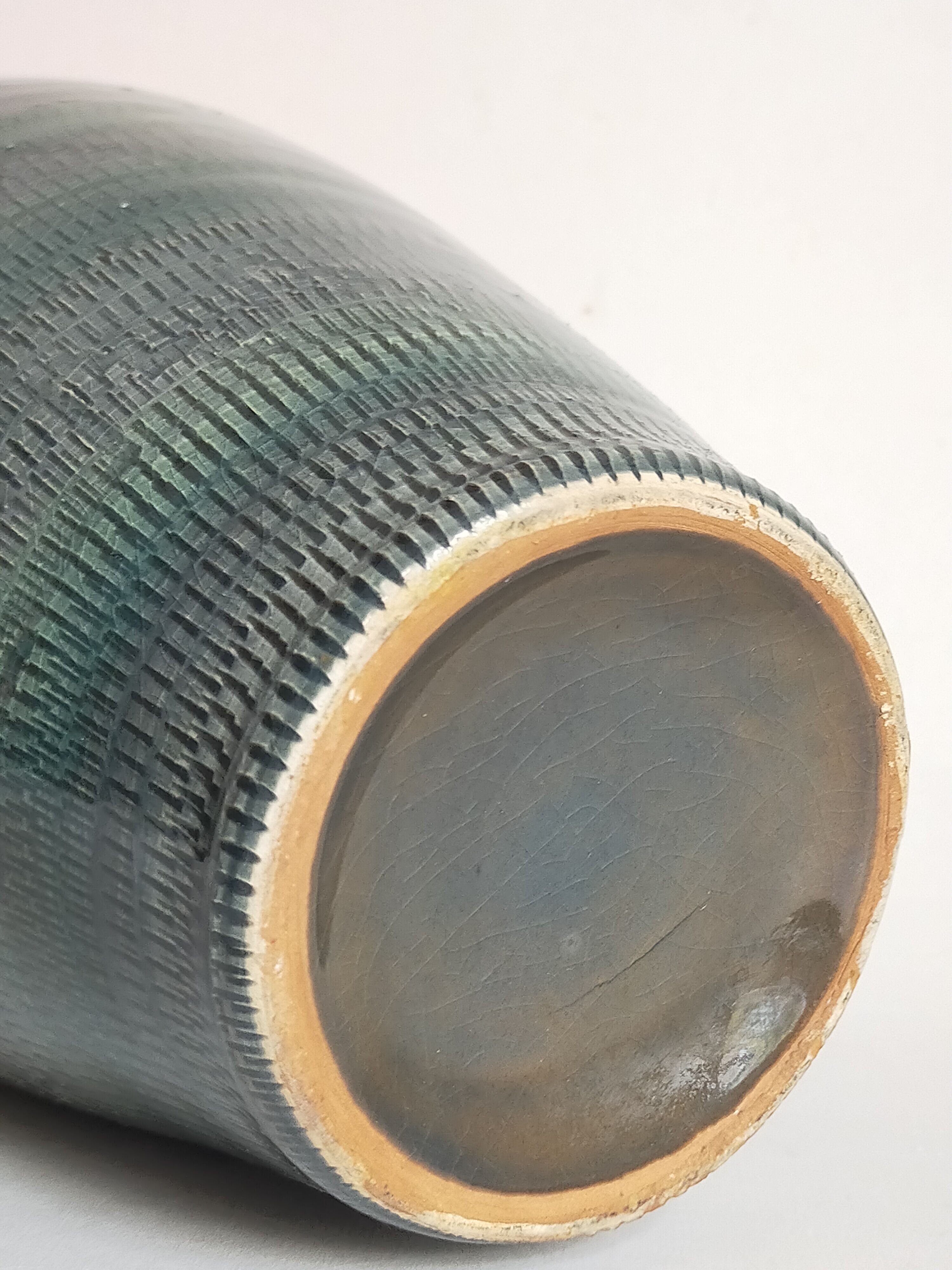 Oblong ceramic vase sacrificed with blue enamel