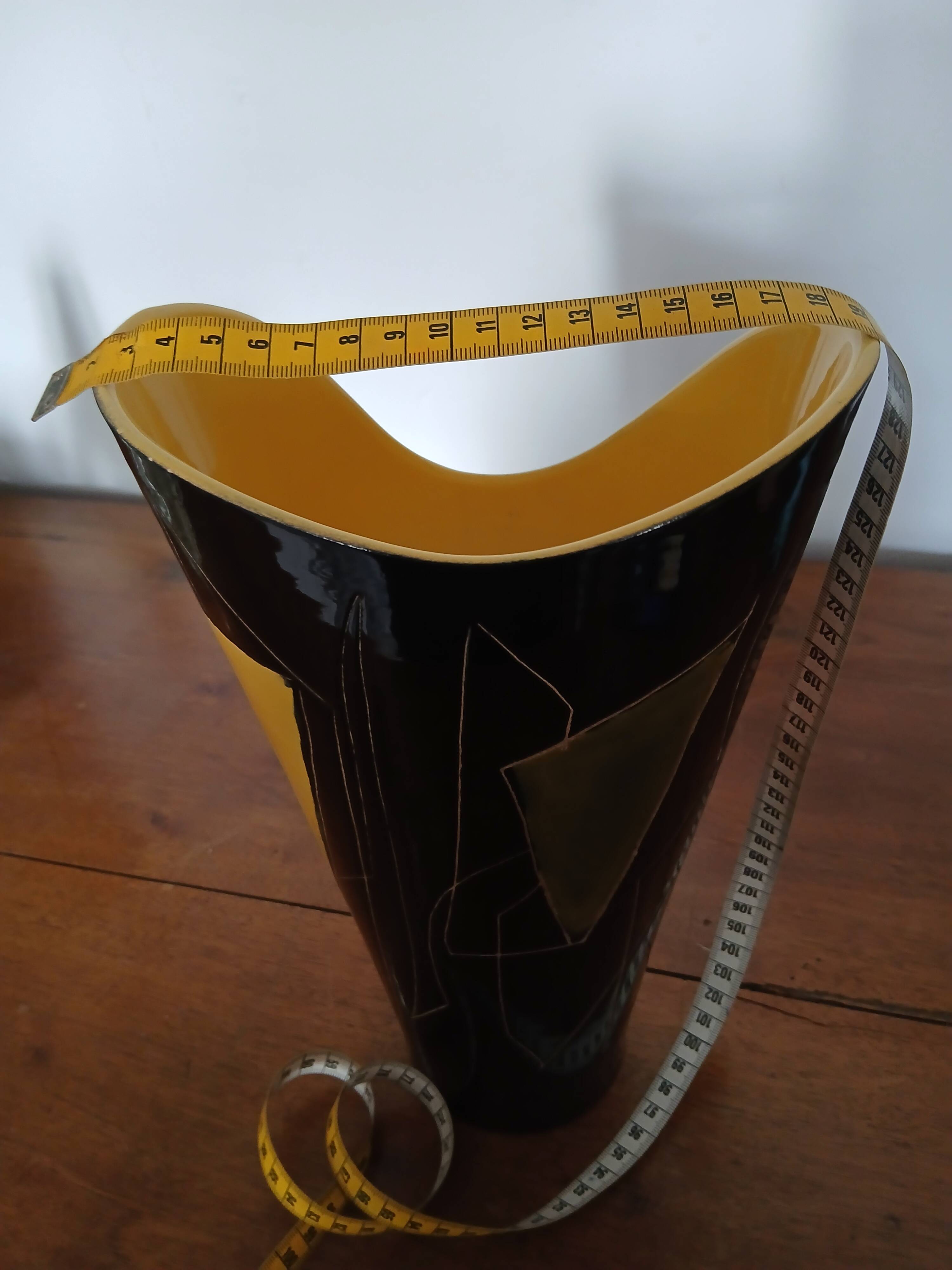 Yellow and black ceramic vase
