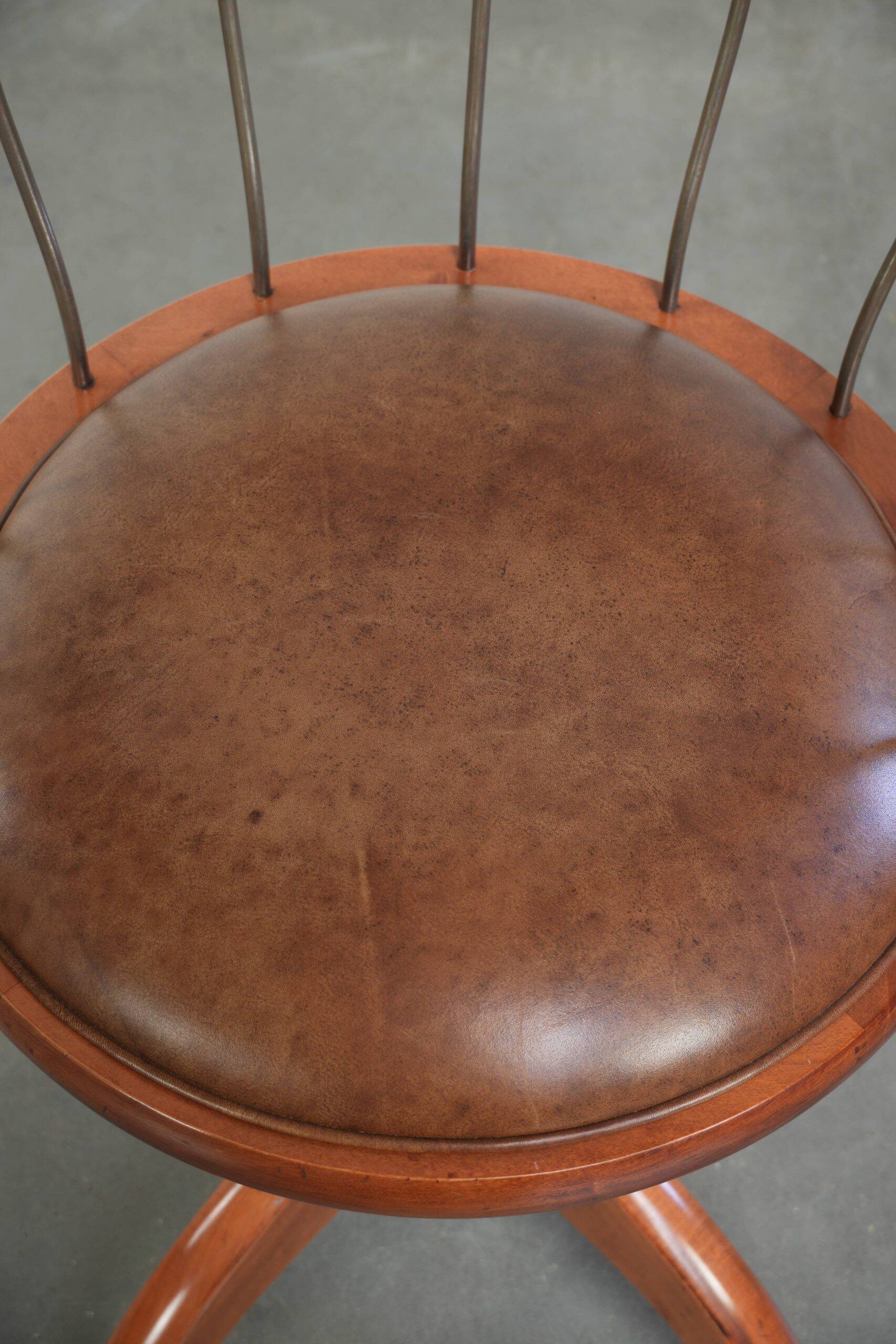 Swivel side chair / office chair with a cognac-coloured cow leather seat