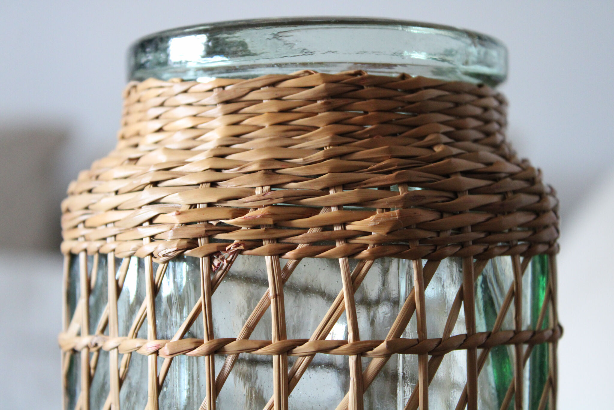 Glass and wicker vase