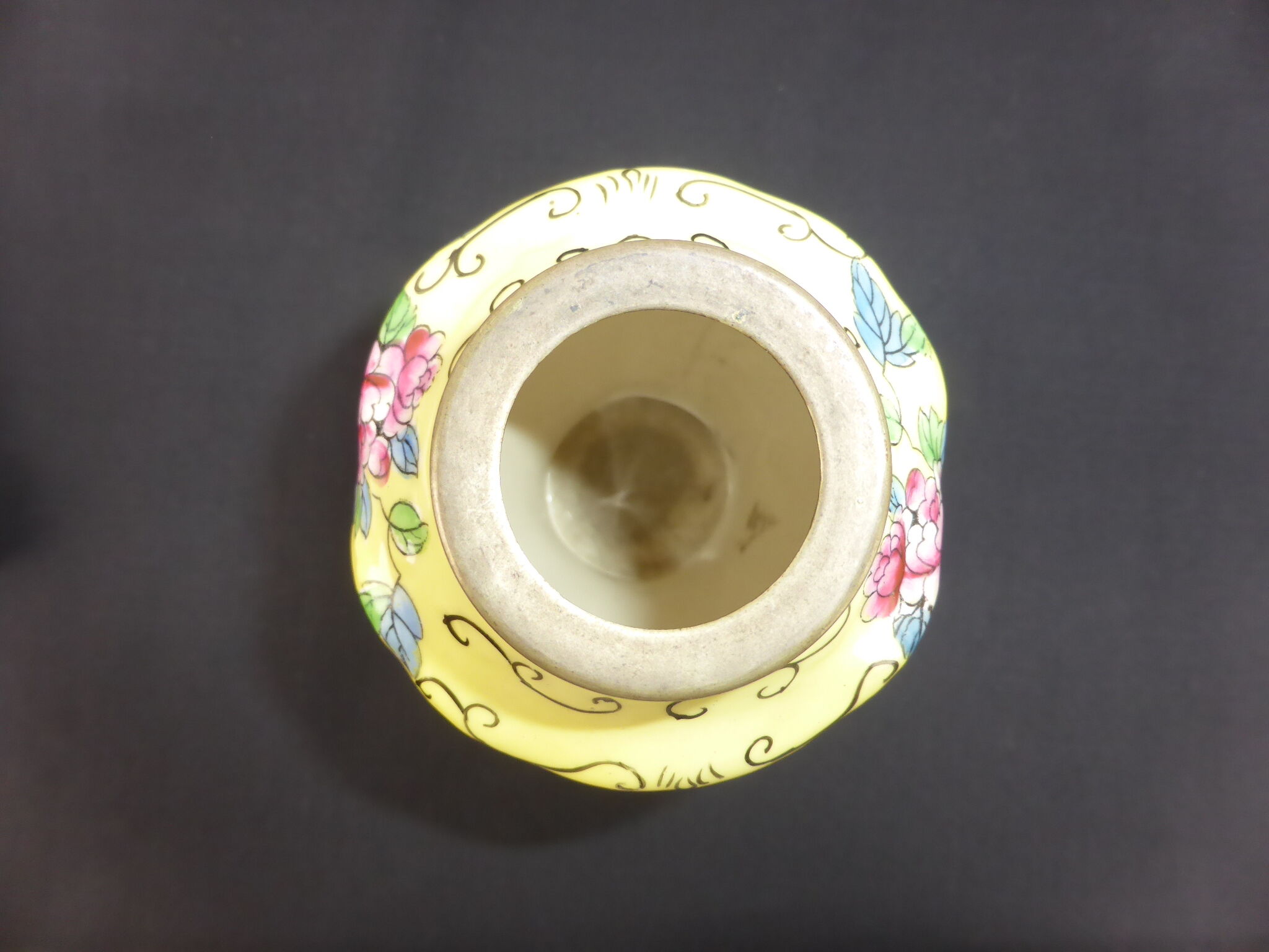 Old yellow ceramic vase decorated with flowers and a pheasant