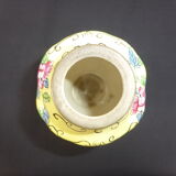 Old yellow ceramic vase decorated with flowers and a pheasant