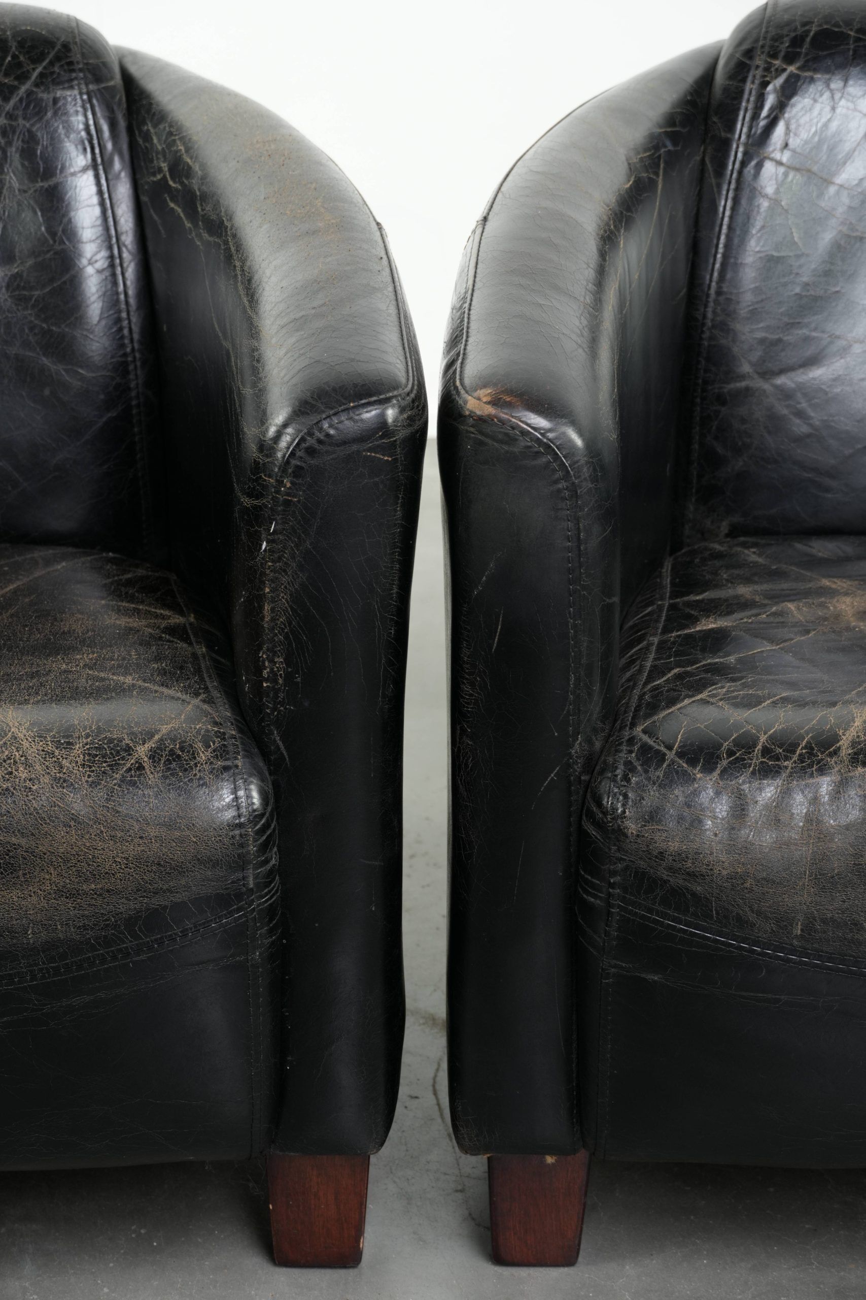 Set of two black vintage cowhide aviator design armchairs