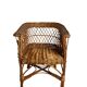 Vintage, children's armchair in woven rattan from around 1970.