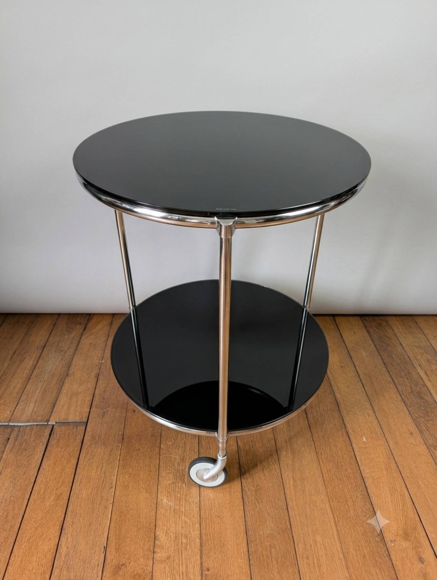 Vintage side table on wheels – black glass top