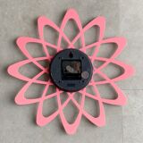 Pink Karlsson wall clock in a mid century shape