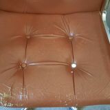 Brown leather armchairs