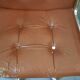 Fauteuils marron en cuir