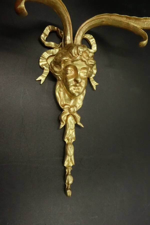 Pair of large Louis XVI style sconces with male faces - bronze