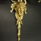 Pair of large Louis XVI style sconces with male faces - bronze