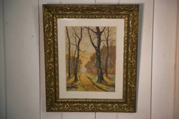 Lithograph of a woodland path, gilt frame, with embossed foliage decoration, 1950s