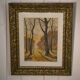 Lithograph of a woodland path, gilt frame, with embossed foliage decoration, 1950s