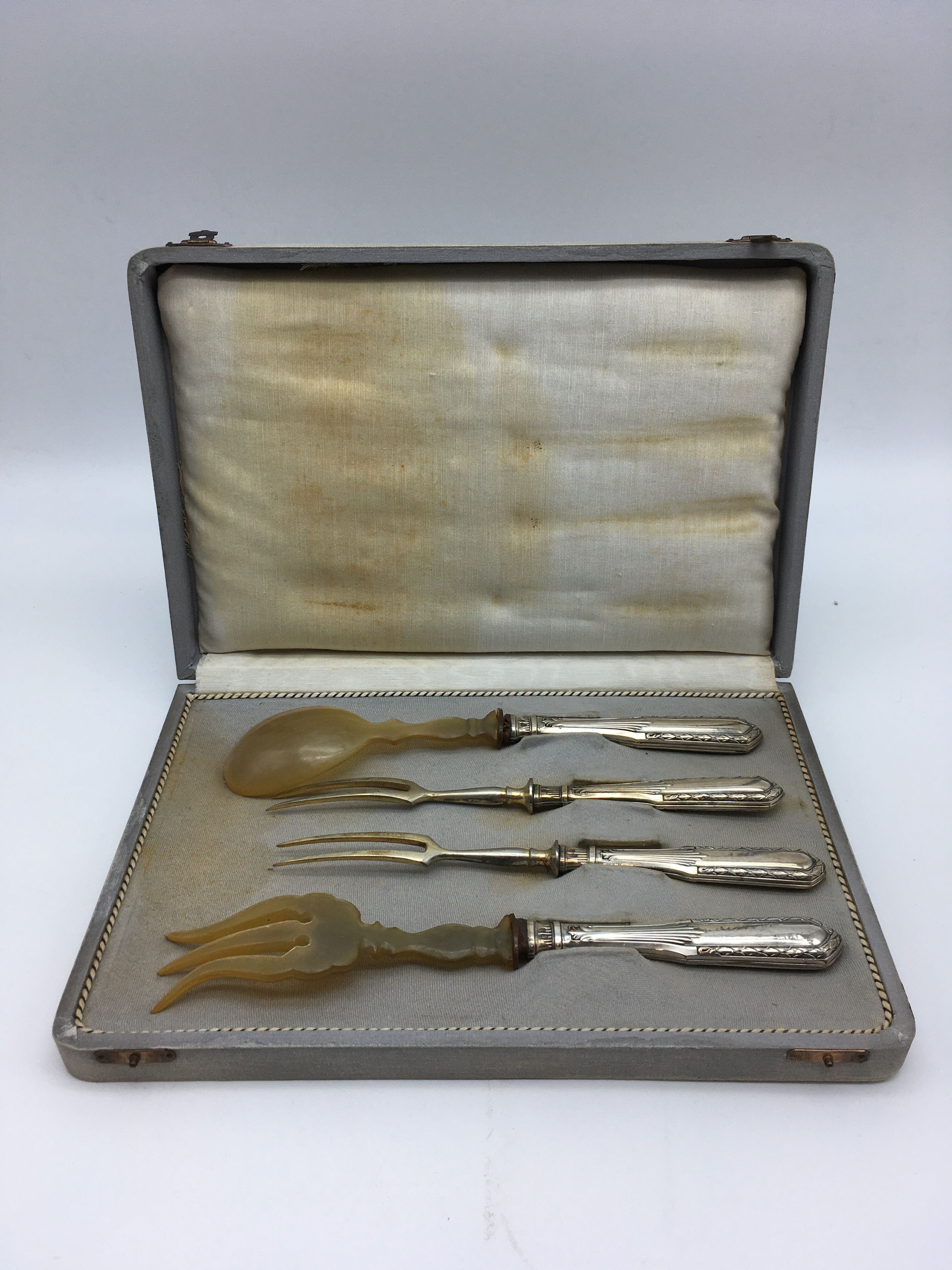 Box of filled silver salad cutlery