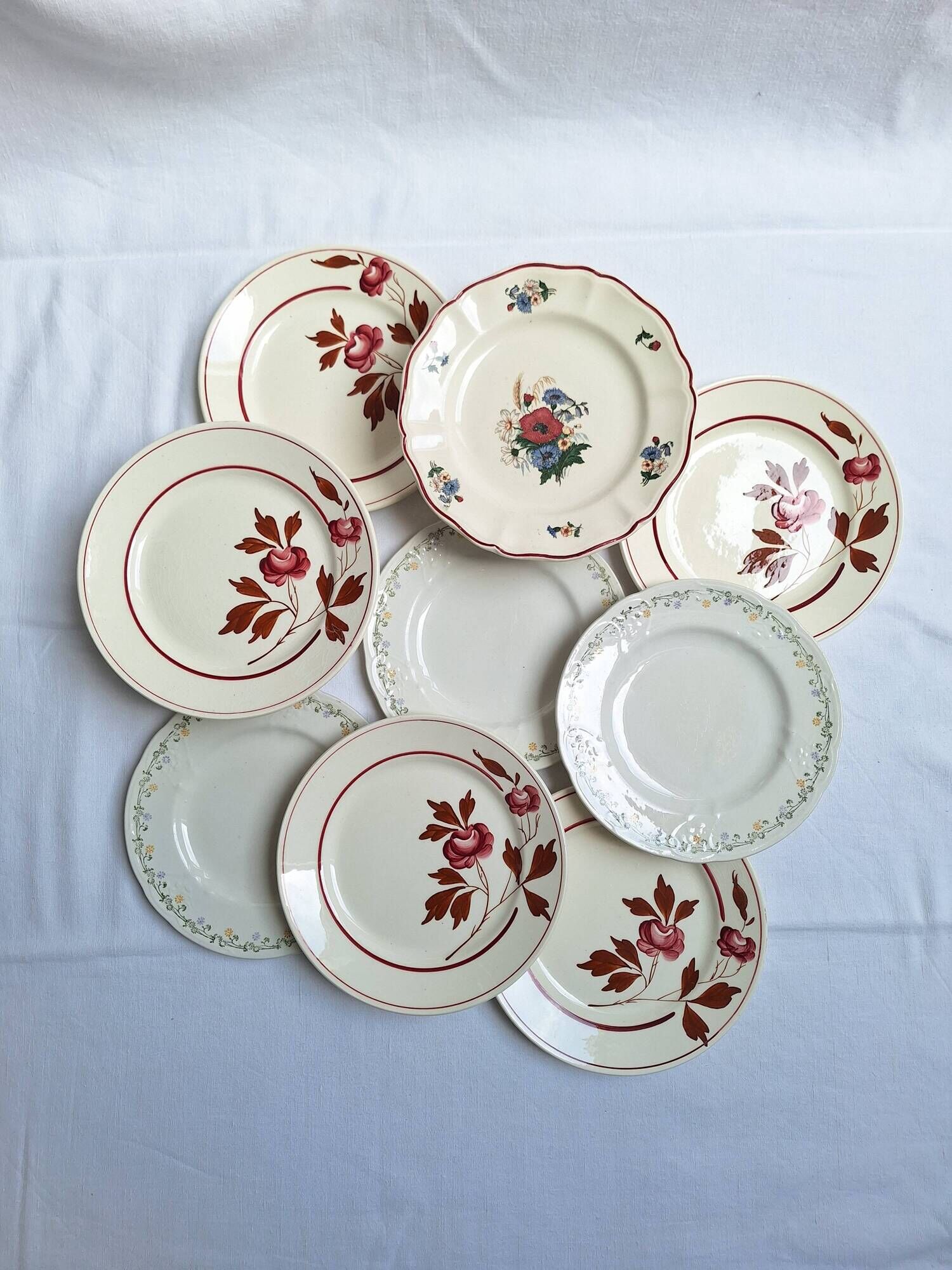 Vintage flower dessert plates from Sarreguemines, Longwy, and Lunéville.