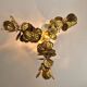 Large brutalist brass chandelier with floral decoration, 1970s.