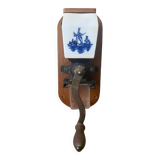 Old wall-mounted coffee grinder