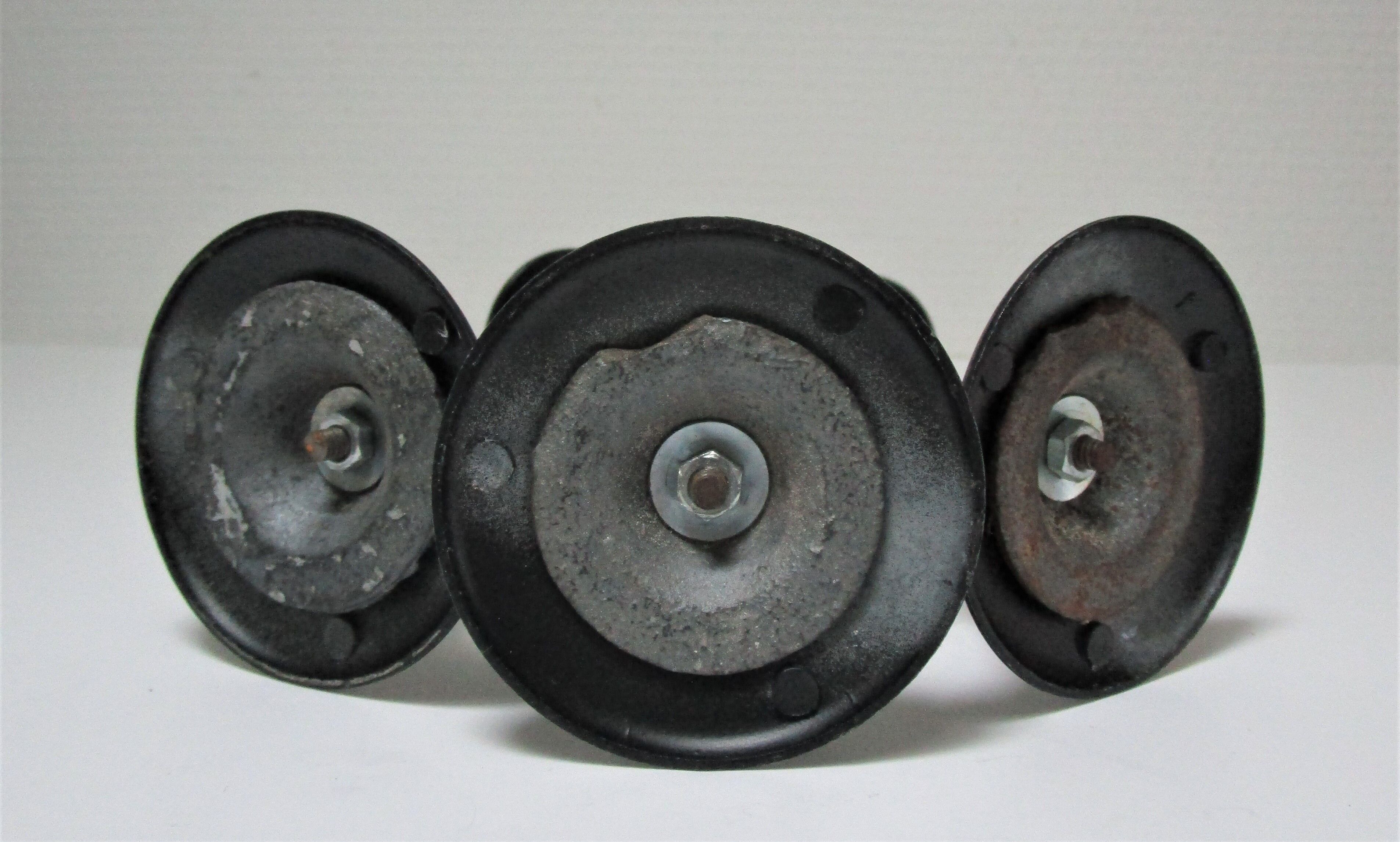 Three Scandinavian black lacquered metal candle holders