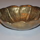 Empty-pocket flower in solid brass