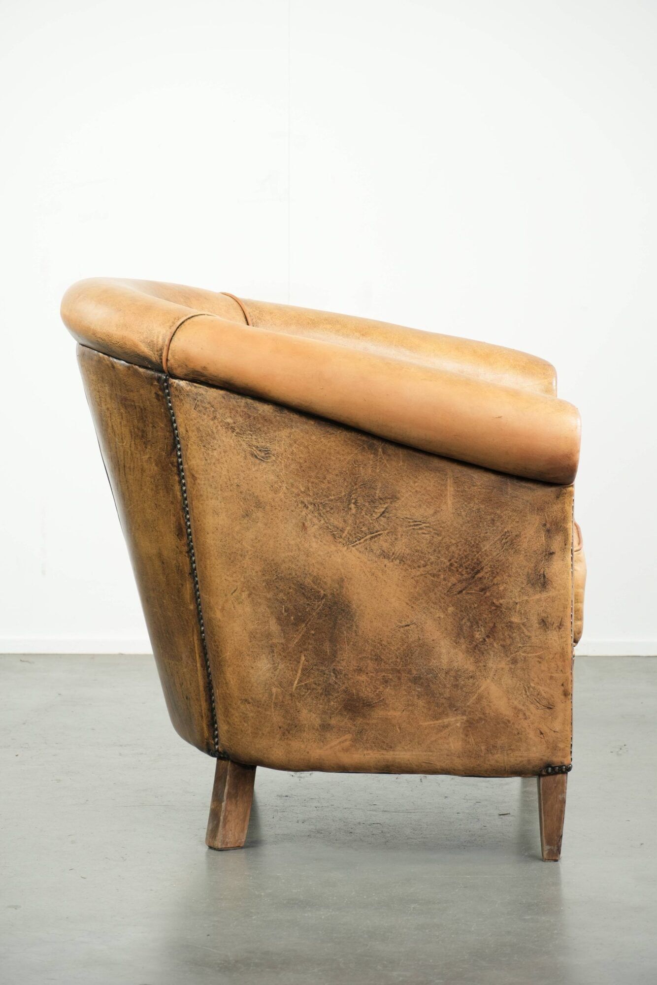 Vintage sheepskin club armchair in a light cognac colour