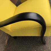 Pair of yellow Art Deco armchairs in cotton and wood, black frame, 1920s.