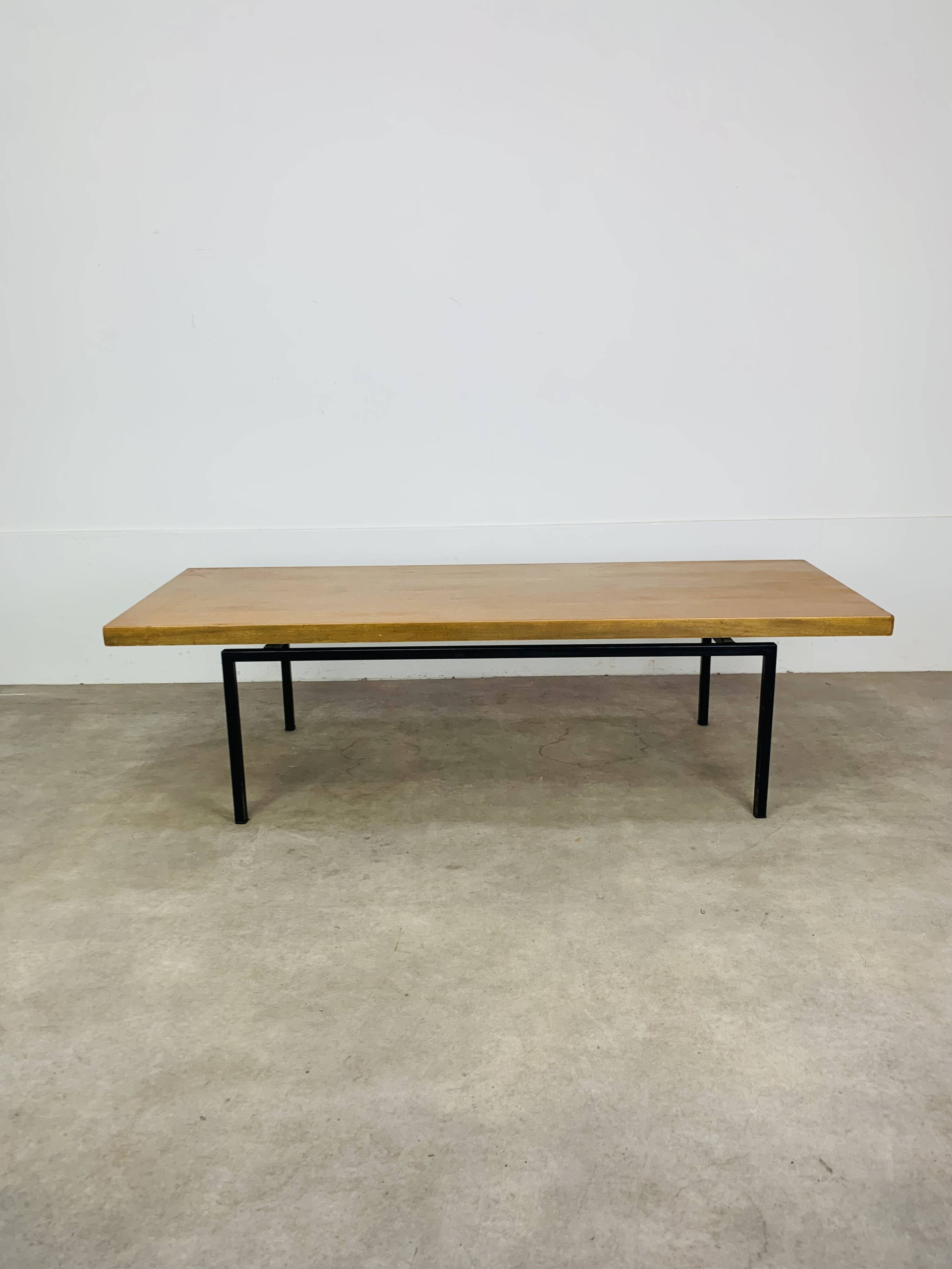 1950s modernist coffee table, wood and black metal.