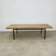 1950s modernist coffee table, wood and black metal.