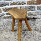 Farm stool in raw wooden sitting in the shape of a popular art