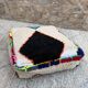 Berber floor pouf: Handwoven Moroccan wool cushion.