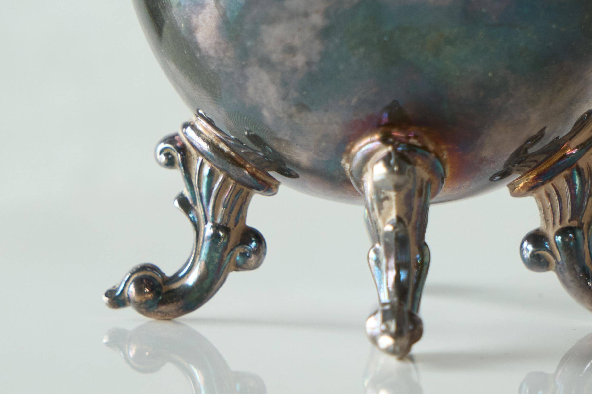 Neoclassical cup with a patinated and silvered copper base.