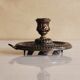 Bronze cellar rat hand candle holder
