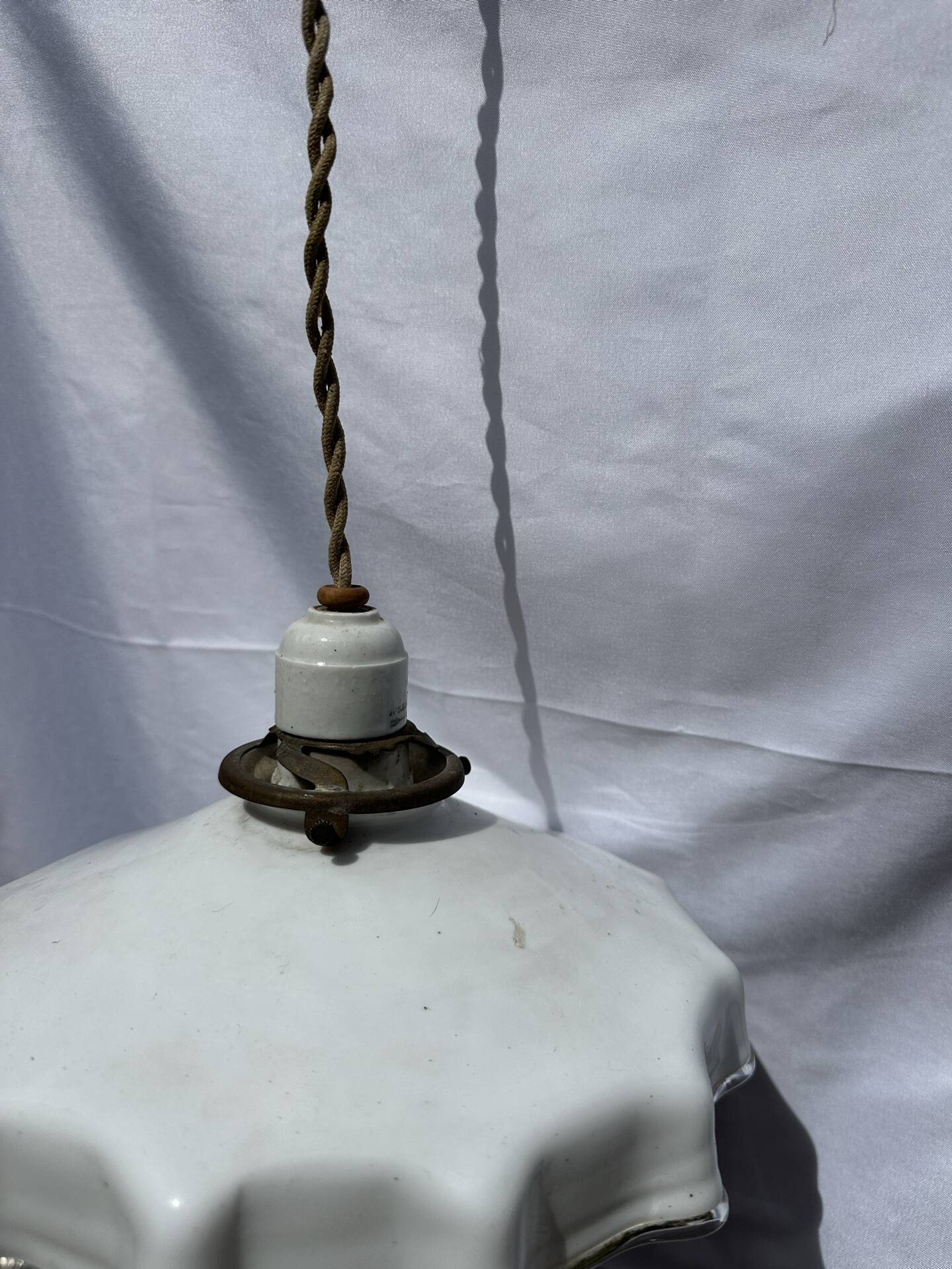 Vintage pleated opaline suspension with porcelain fittings.