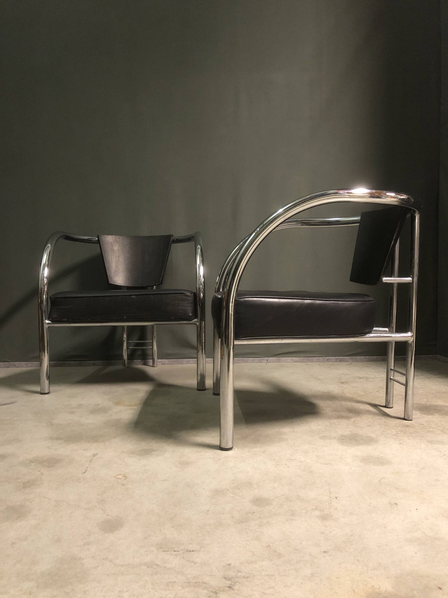 A pair of petite low armchairs by ronald cecil sportes for lumen center, 1987