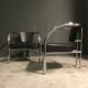 A pair of petite low armchairs by ronald cecil sportes for lumen center, 1987