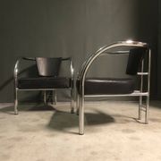 A pair of petite low armchairs by ronald cecil sportes for lumen center, 1987