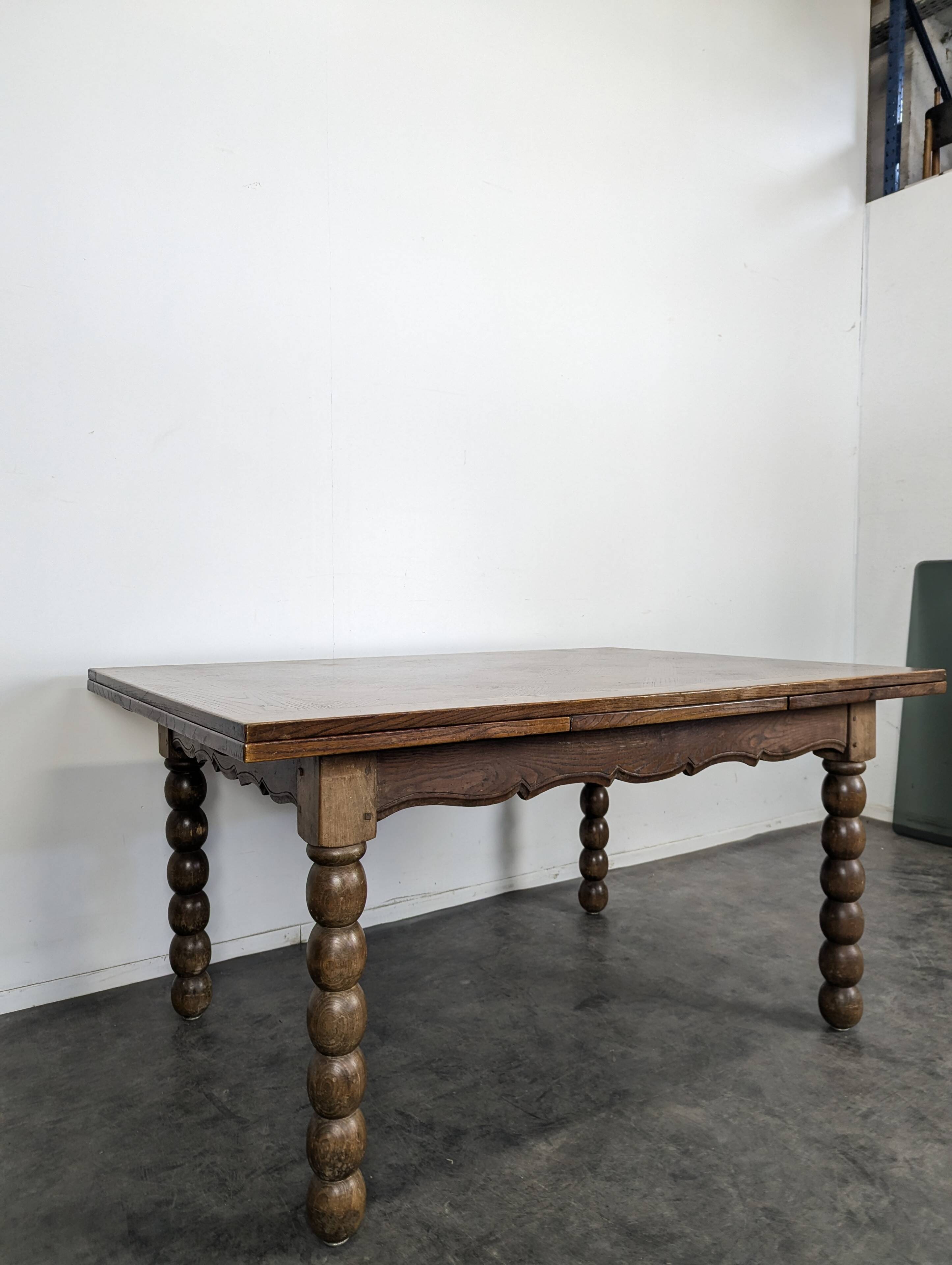 Dining table with turned oak legs.