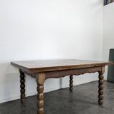 Dining table with turned oak legs.