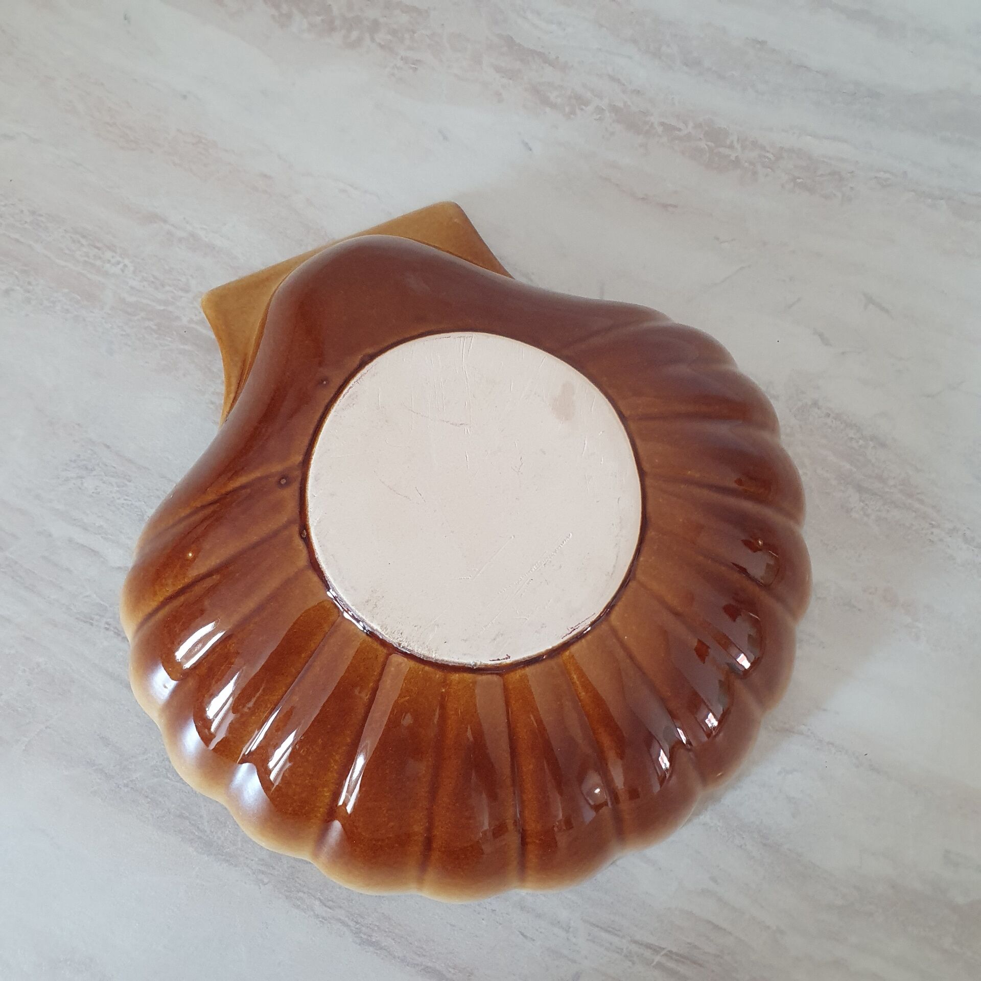 Brown and white ceramic shell bowl