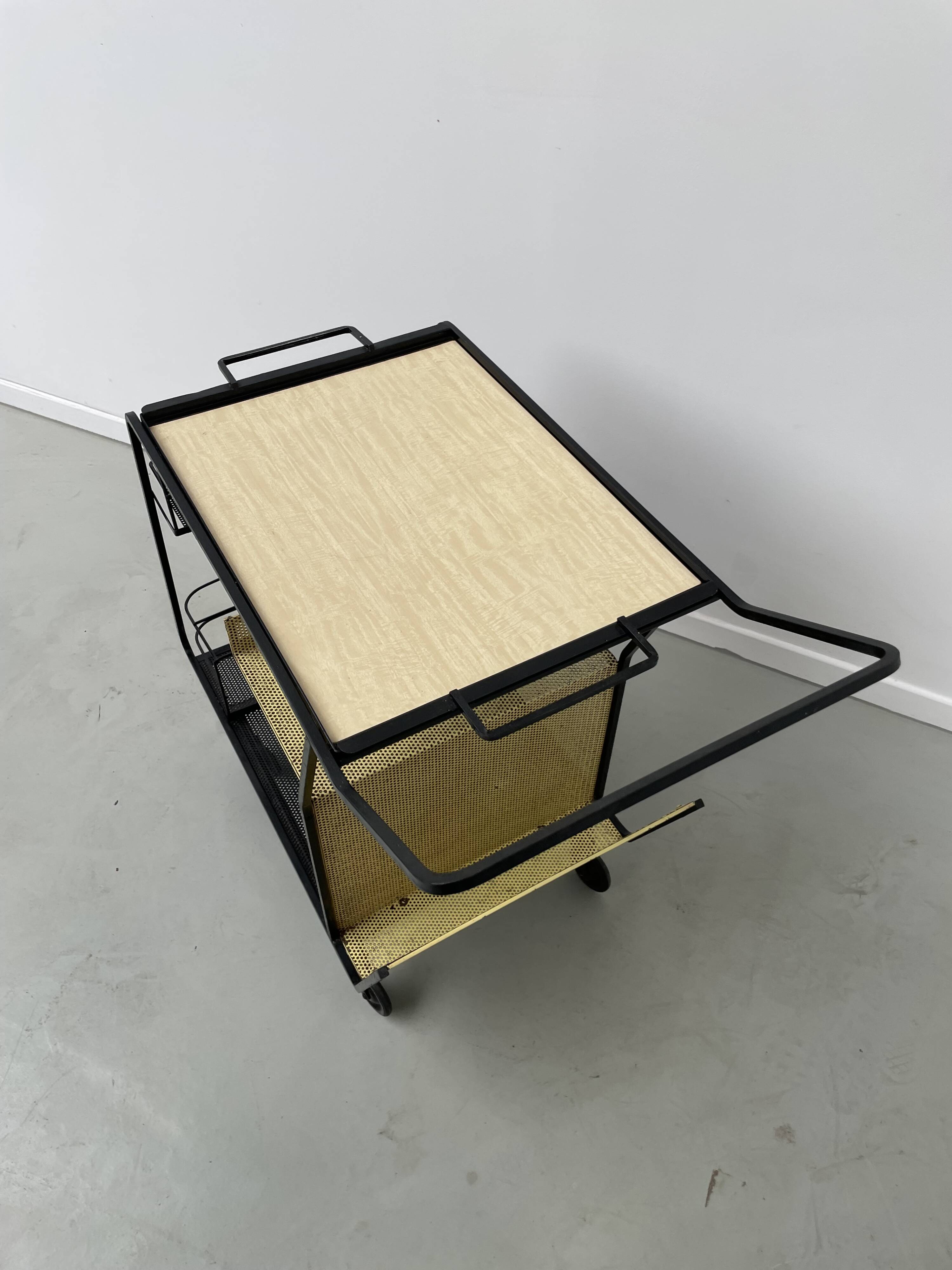 Perforated metal serving trolley in the Mathieu Matégot style