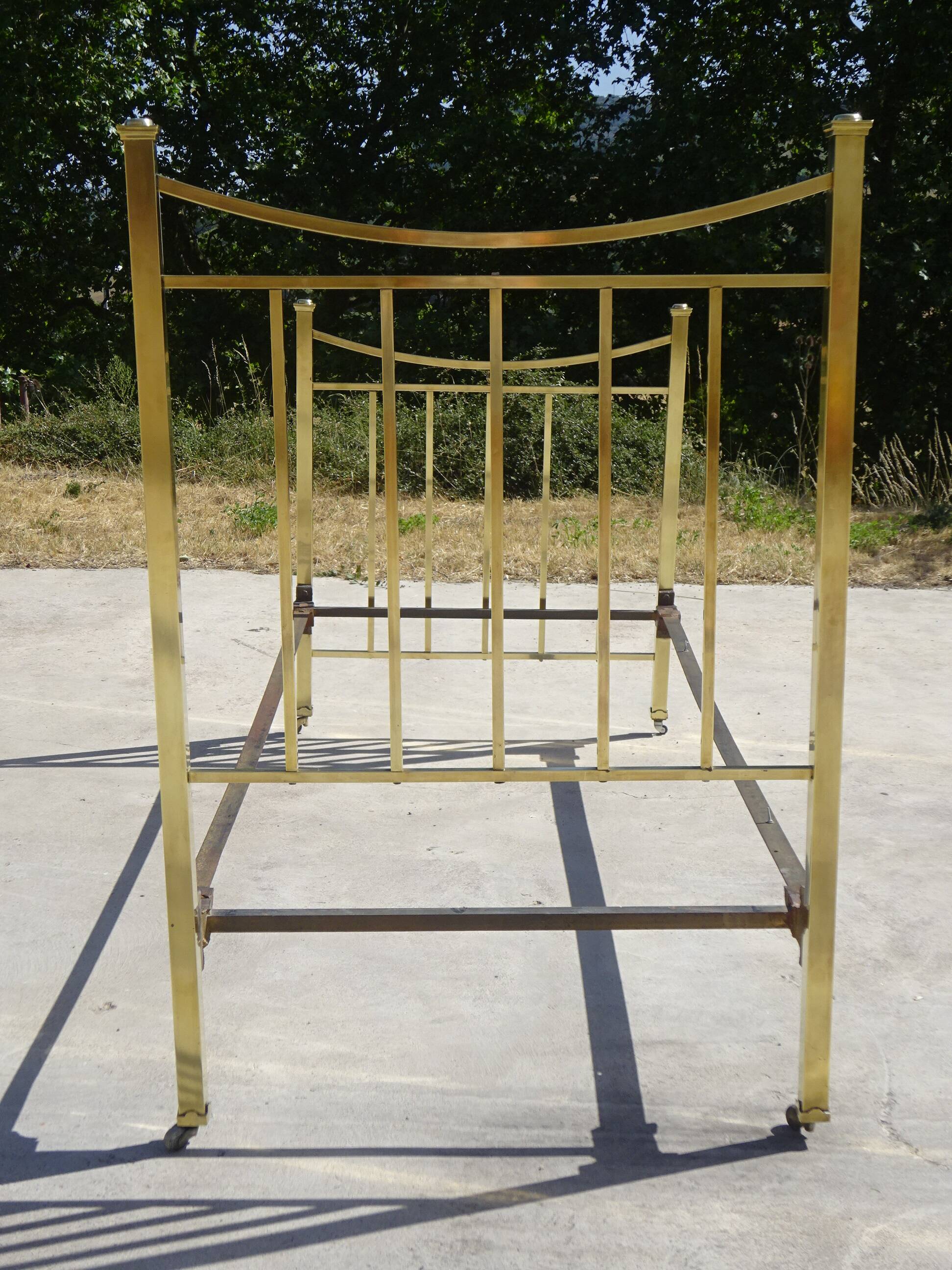 Antique gold-plated brass bed for one person.