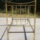 Antique gold-plated brass bed for one person.