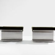Pair of ottomans by Paul Geoffroy, brushed steel and alcantara, 1975