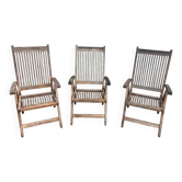 Lot de trois fauteuils de jardin pliants anciens en bois exotique ou teck