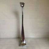 Large silver metal candlestick in the style of Xavier Lust