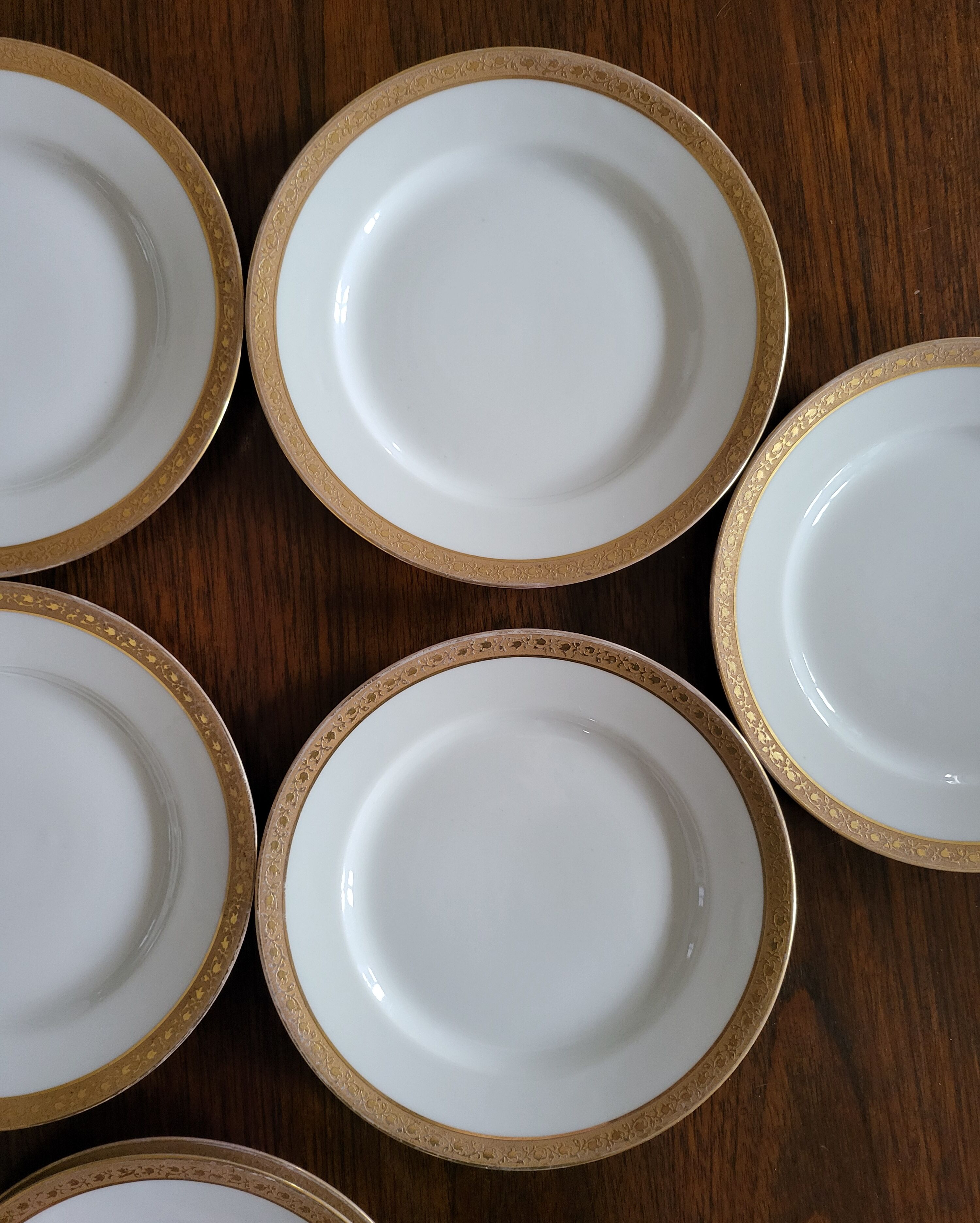 Lot of 8 small porcelain bread plates.