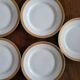 Lot of 8 small porcelain bread plates.