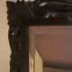 Antique mirror in carved wood