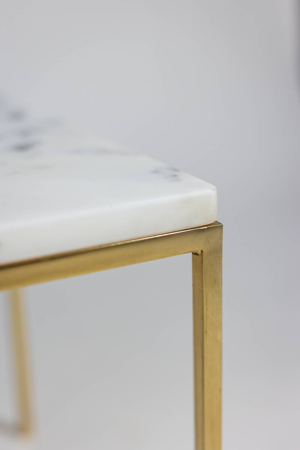 Pair of marble and gilt bronze end tables. 1970s.
