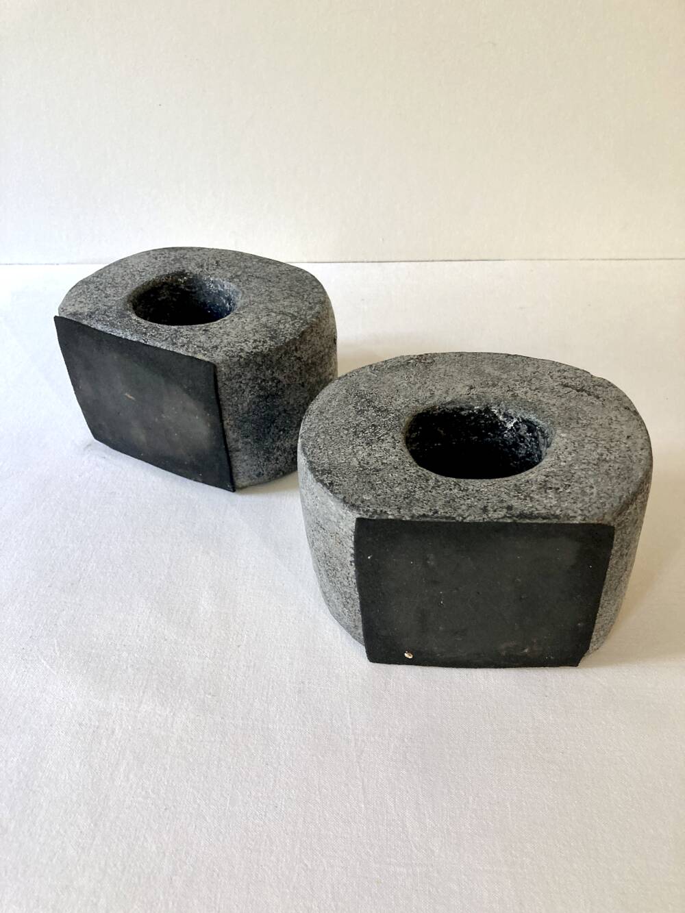 Pair of terracotta candle holders with anthracite finish, 1980s.