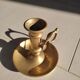 Brass table candle holder with candle push system